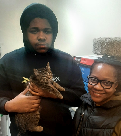 Cat with adopting family: Ali